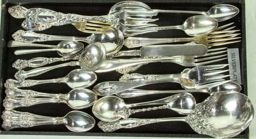 Twenty-three pieces of sterling flatware service in various patterns and makers, with twenty-seven