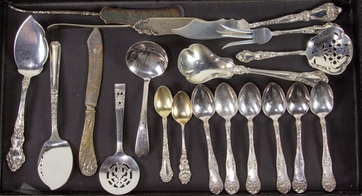 A group of thirteen assorted sterling flatware articles including diminutive spoons, a tea straining