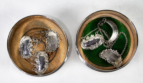 Two English sterling silver wine coasters