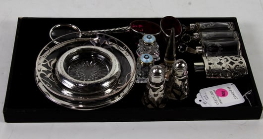 A group of twelve silver mounted glass and champleve table articles comprising dressing table