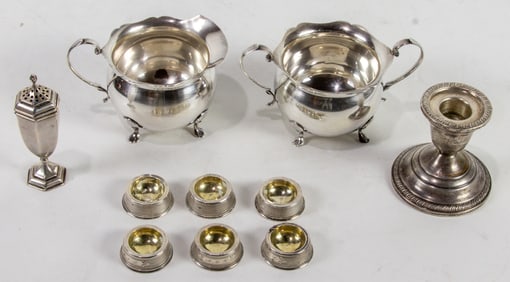 A ten piece sterling and coin silver group comprising coin silver open salts, a sterling sugar and