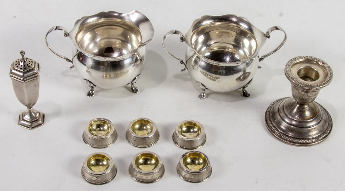 A ten piece sterling and coin silver group comprising coin silver open salts, a sterling sugar and (1 of 1)
