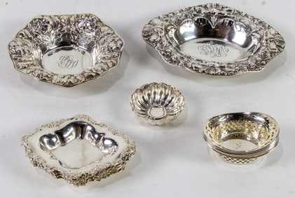 Fourteen sterling dishes comprised of nut dishes and repousse examples, including Gorham
