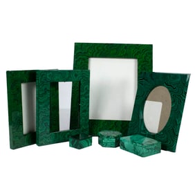A group of malachite and faux-malachite desk articles including boxes and frames