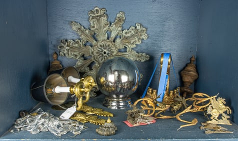 An assembled group of decorations, including a pair of Empire style wall lights, a Regency style
