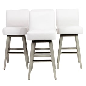 A set of four Serena & Lily upholstered swivel stools