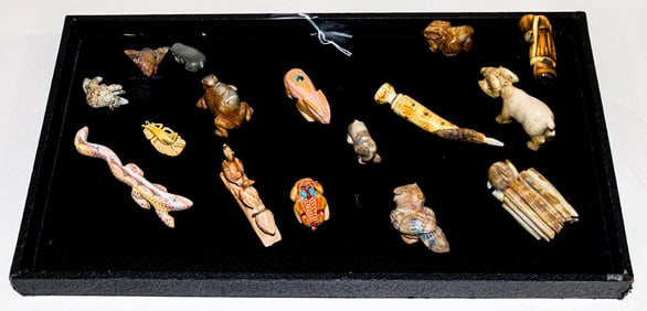 A collection of sixteen carved stone fetishes