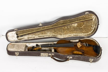 A student violin with bow in case