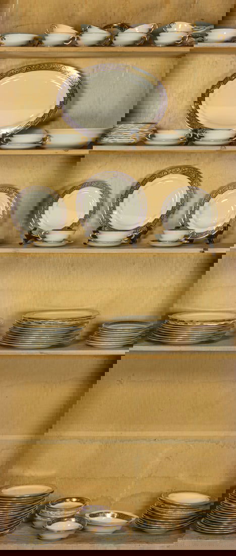 An extensive Lenox porcelain service in the Barclay pattern: An extensive Lenox porcelain service in the Barclay pattern, each with gilt cobalt border on ivory ground, comprising (26) dinner plates, 10.5"dia; (20) lunch plates, 8.25"dia; (9) salad plates, 7"dia