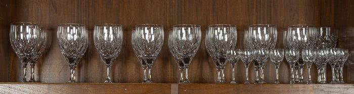 A Stuart cut glass suite of stemware in the Kent pattern, comprising champagne, goblet, wine and