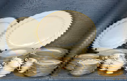 A Lenox porcelain assembled dinner service in the Golden Wreath and Mansfield patterns