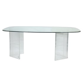 A Hollywood Regency style glass and lucite dining table