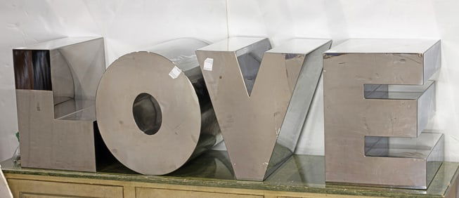 Four stainless steel letters: LOVE