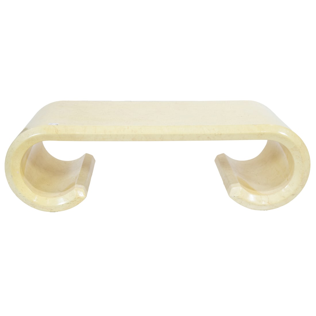 A Karl Springer style parchment covered scroll cocktail table: A Karl Springer style parchment covered scroll cocktail table, 16.5"h x 52"w x 25"d