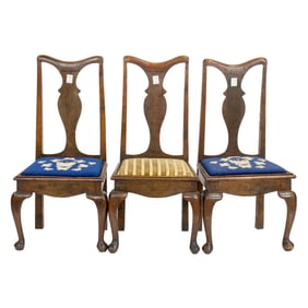 A set of three George III style oak side chairs