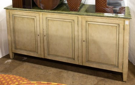 A paint decorated three-drawer sideboard with faux marbleized top in the Neoclassical taste