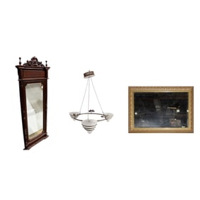 Two mirrors and a light fixture