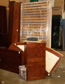 A large contemporary rosewood veneer bed frame