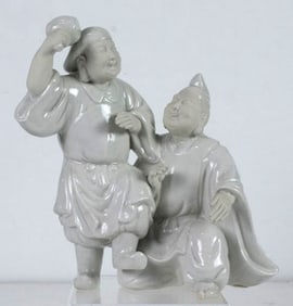 A Japanese white glazed figures