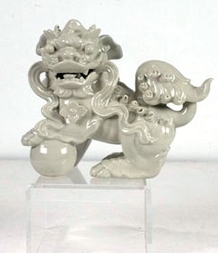 A Chinese white glazed foo dog