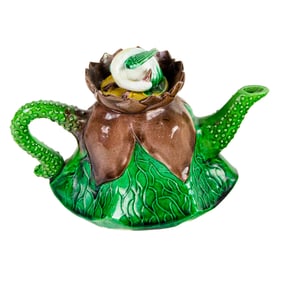 A Chinese green and aubergine glazed 'lotus' teapot