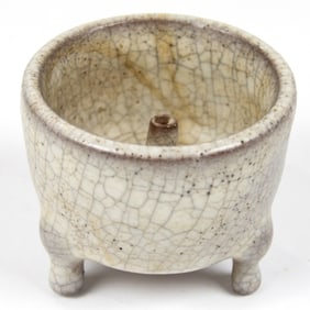 A Chinese crackle glazed tripod censer