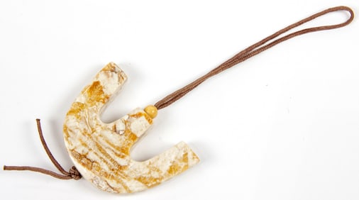 A Chinese chicken bone jade pendant