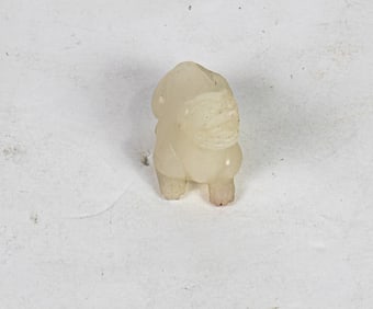 A Chinese white jade figure of a mythical beast