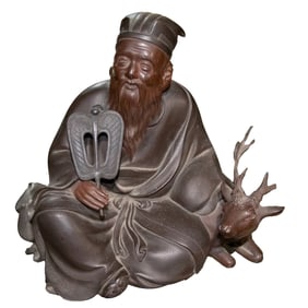 A Japanese patinated bronze figure of Jurojin