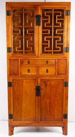 A Chinese elm wood corner cabinet