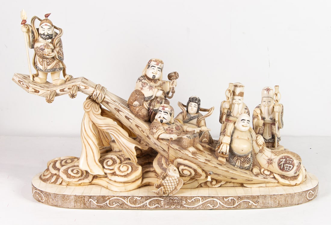 A Japanese bone carving: A Japanese bone carving. Depicting the the Seven Lucky Gods, 20th century, 28.5" wide.