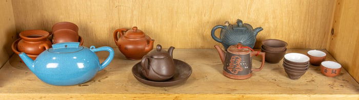 A group of Chinese Yixing teapots and cups