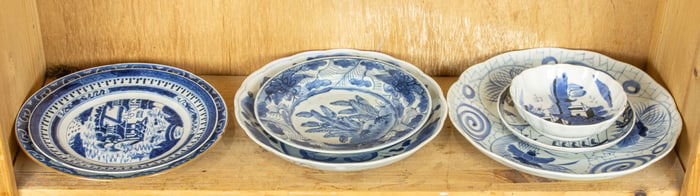 A shelf of Chinese export blue and white dishes