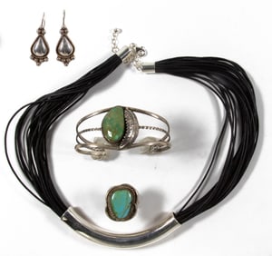 A group of Native American silver and turquoise jewelry