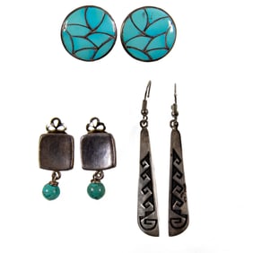 Three pairs of turquoise and silver earrings and ear clips
