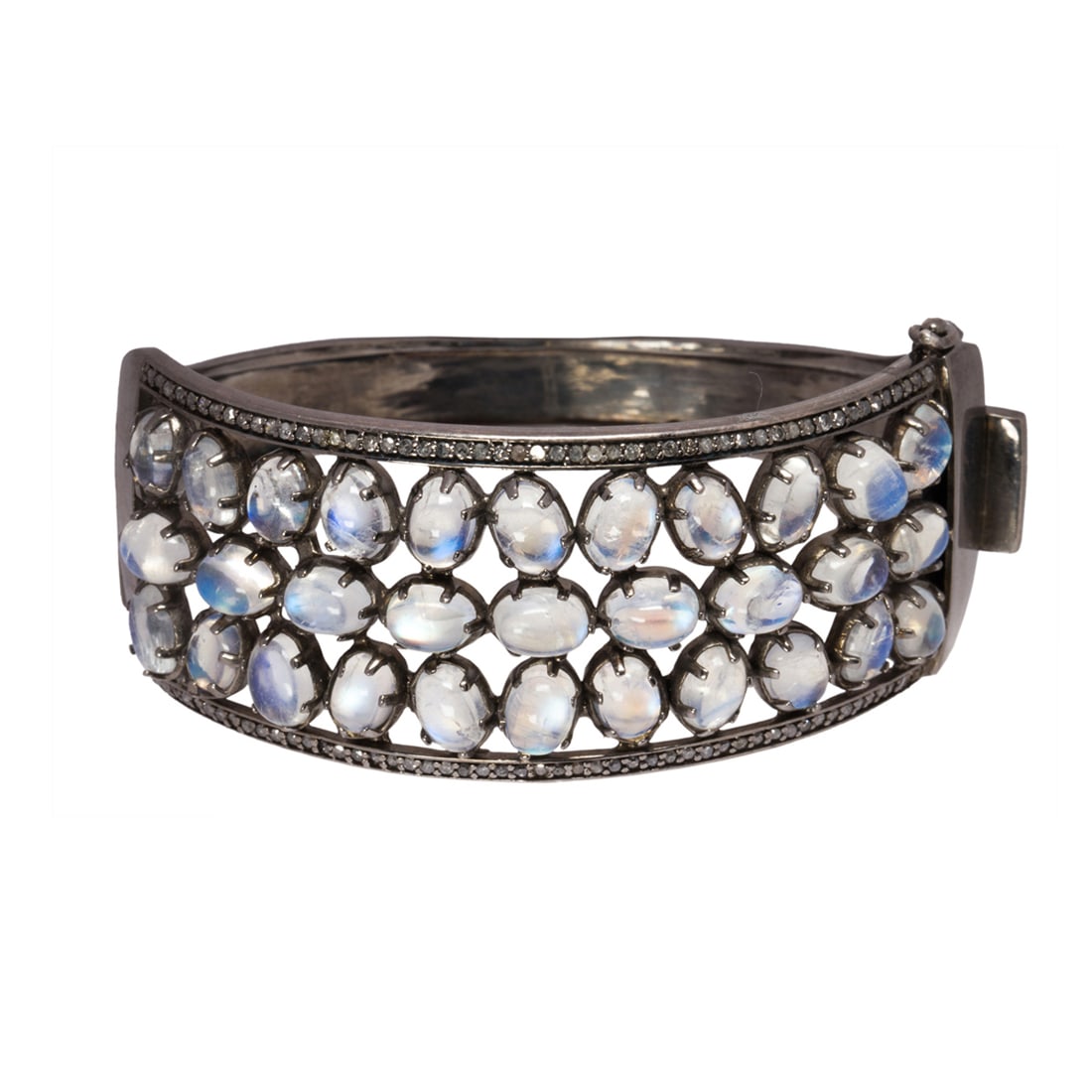 A moonstone, diamond and blackened silver bracelet: A moonstone, diamond and blackened silver braceletthe hinged bangle featuring numerous oval moonstone cabochons, measuring approximately 6.00 x 5.00 x 3.00 mm, trimmed by single-cut diamonds; 49.10 gr
