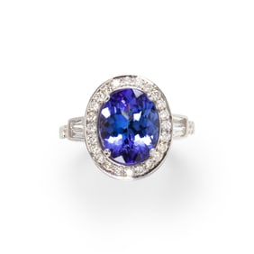 A tanzanite, diamond and eighteen karat white gold ring