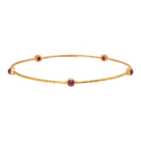 A ruby and 18k gold bangle bracelet