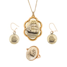 A scrimshaw and gold filled set