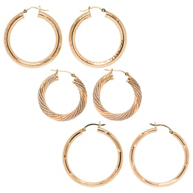 Three pairs of 14k gold hoop earrings