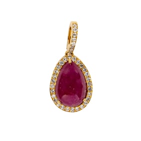 A ruby, diamond, and 18k gold pendant
