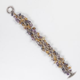 A silver and multicolored beaded bracelet