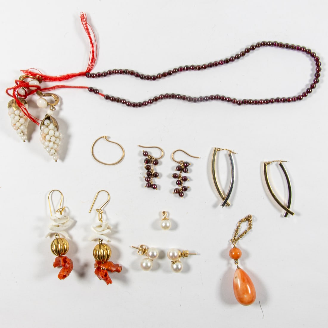 A group of miscellaneous coral and hardstone jewelry: A group of miscellaneous coral and hardstone jewelryComprising an assortment of miscellaneous jewelry including coral and hardstone; gross weight: 42.00 grams