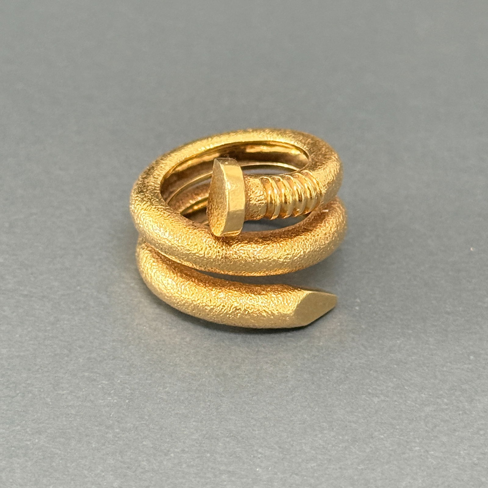 David Webb 18K Yellow Gold Hammered Nail Ring: David Webb 18k yellow gold hammered nail ring. Signed "DAVID WEBB 18K" & "E 267"; ring size 6.5; gross weight 16.2 grams. NOTE: THIS ITEM IS IN NEW YORK WHERE IT CAN BE SHIPPED FROM.