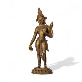 A Gilt Bronze Standing Buddha
