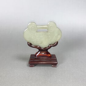 A White Jade Lock-Shaped Plaque with Wooden Stand