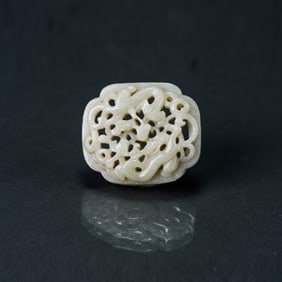 A Pale Green Jade Reticulated 'Dragon' Plaque