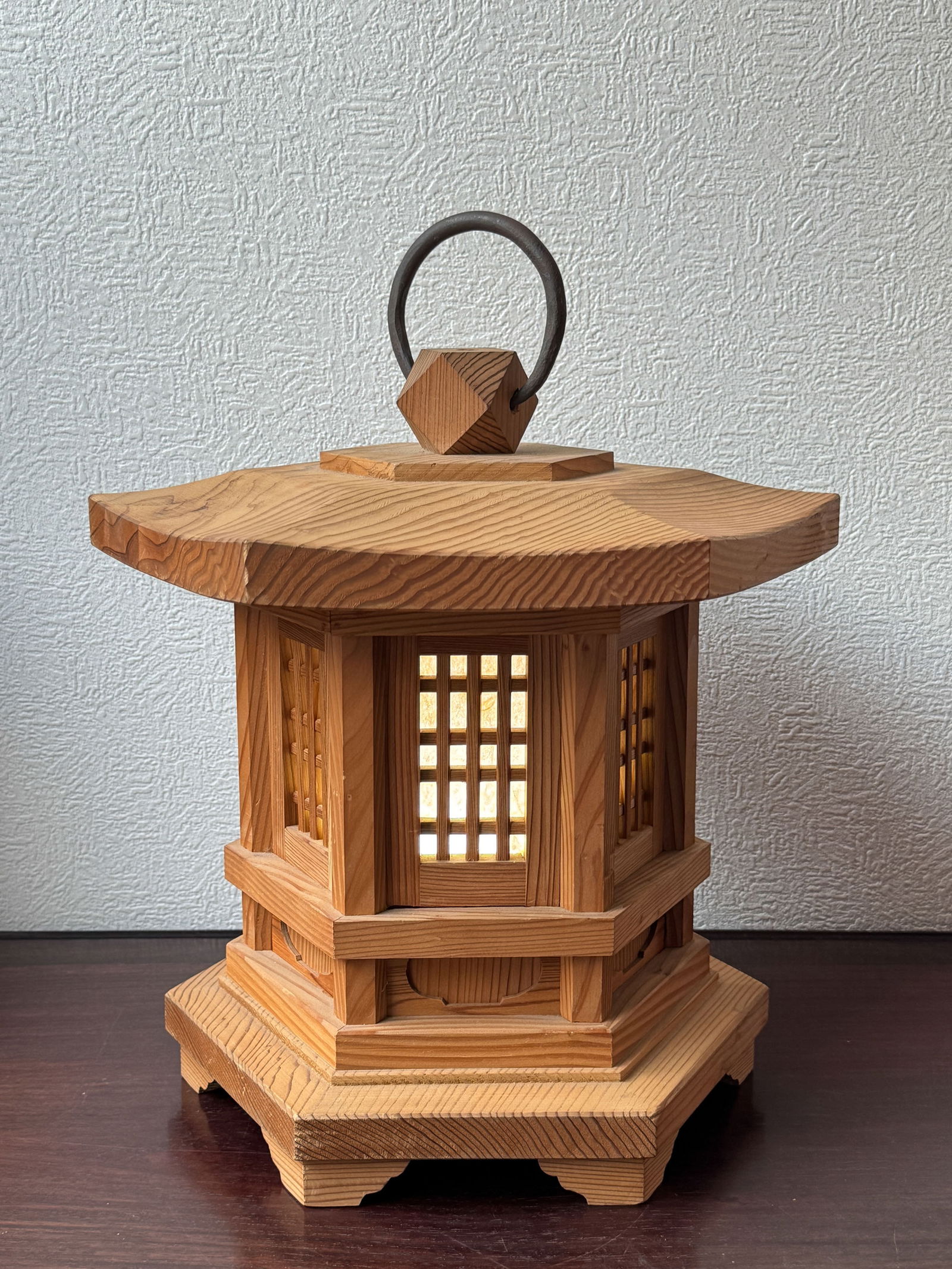 Japanese Wood Pagoda Shaped Lantern with Iron Ring: Japanese wood pagoda shape lantern with iron hanging ring, door can take off to out a light source in. 15.5"h x 13"w (39.37 x 33.02 cm) NOTE: THIS ITEM IS IN OUR NEW YORK, WHERE IT CAN BE SHIPPED FROM