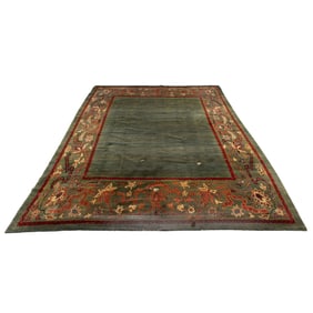 A Pakistani carpet with green ground, Senator Feinstein Estate