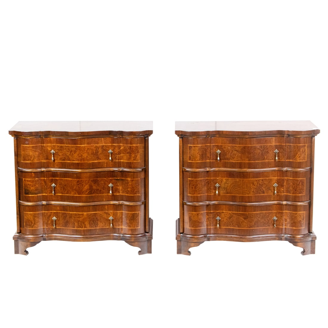 A pair of Italian inlaid side chests, Senator Feinstein Estate: A pair of Italian inlaid side chests in the Georgian taste, each of serpentine outline fitted with three drawers, 29"h x 33"w x 19"d. Provenance: The Estate of Senator Dianne Feinstein (1933-2023)